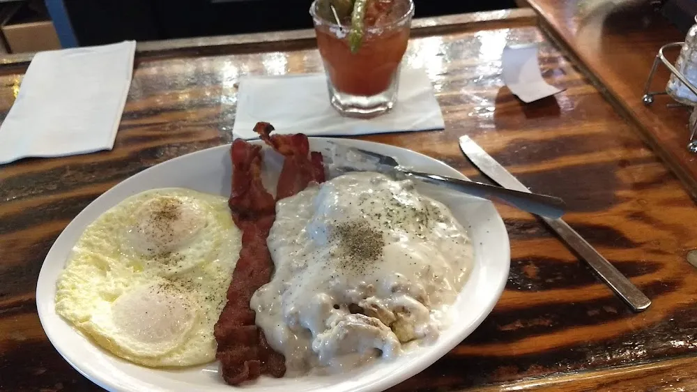 Eggs Bacon and Half Order Biscuits and Sausage Gravy